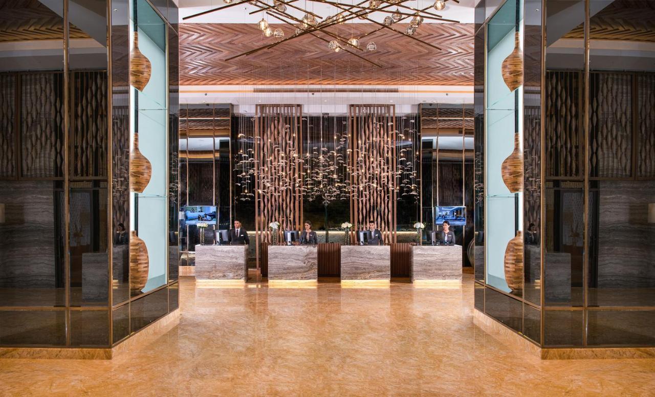 דובאי Al Jaddaf Rotana Suite Hotel מראה חיצוני תמונה The lobby of the hotel